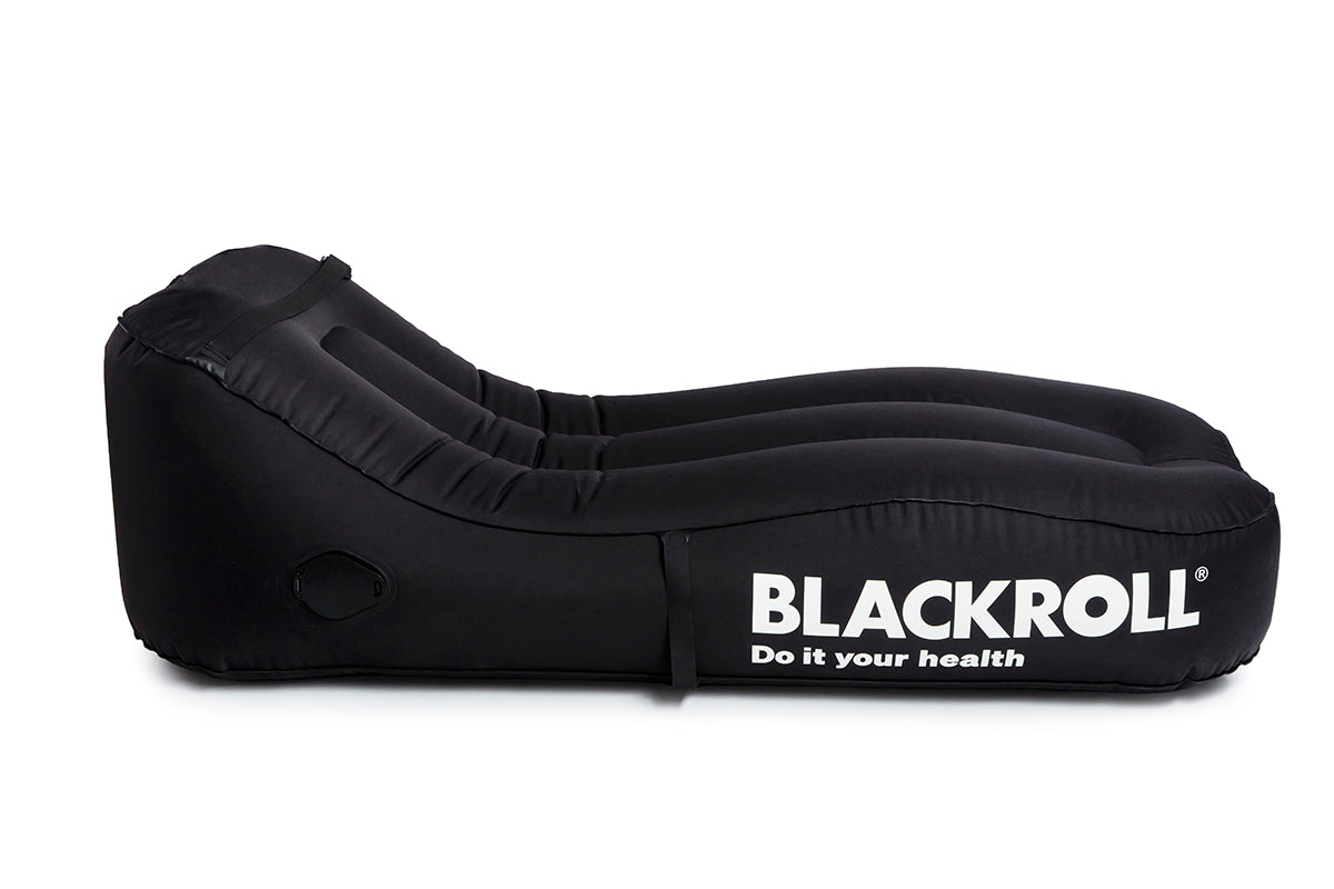 Side view of BLACKROLL Inflatable Lounger showing ergonomic shape and built-in pump compartment