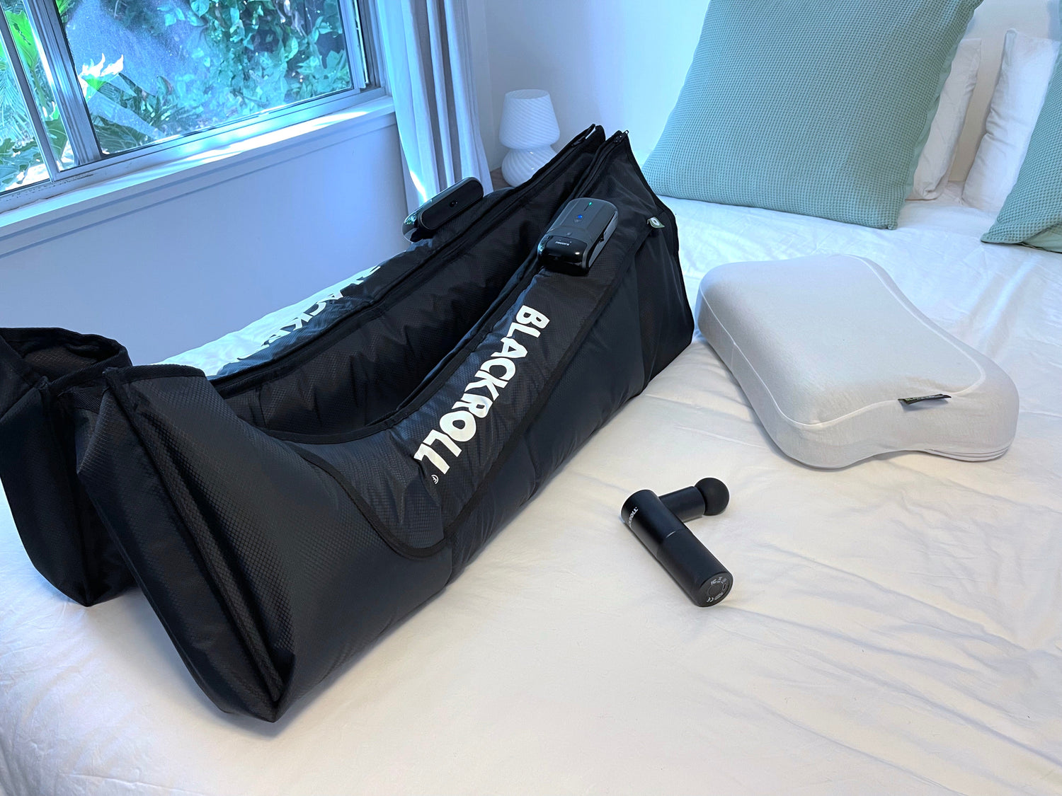 BLACKROLL Compression Boots, Fascia Massage Gun, and Recovery Pillow – elite recovery tools in one compact value set for athletes