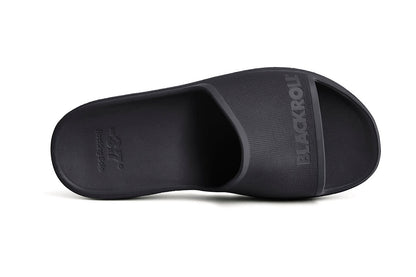 Top-down view of BLACKROLL Recovery Slides showing wide footbed and minimalist design