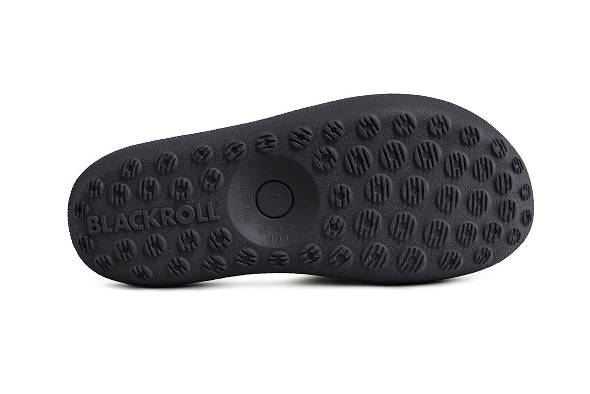 Close-up of curved rocker sole on BLACKROLL Recovery Slopes for improved posture and circulation