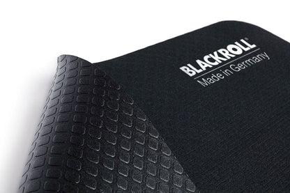 Close-up of BLACKROLL® yoga mat showing textured, non-slip surface